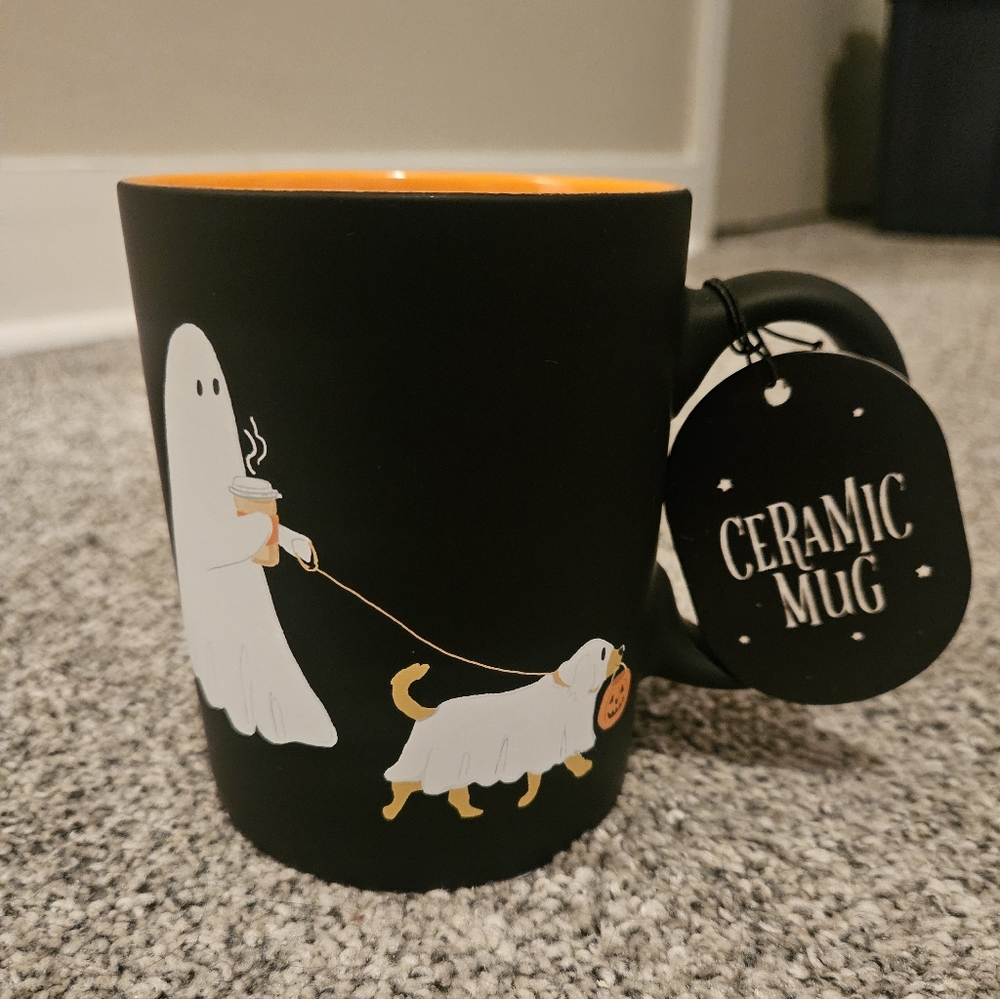 Ghost Walking Dog Mug Holding Latte Black & Orange